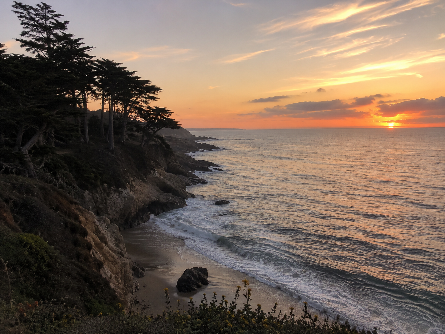 Virtual telehealth provides accessible support for navigating the complex symptoms of perimenopause. A professional woman during a video call in a modern home office with calming coastal decor.