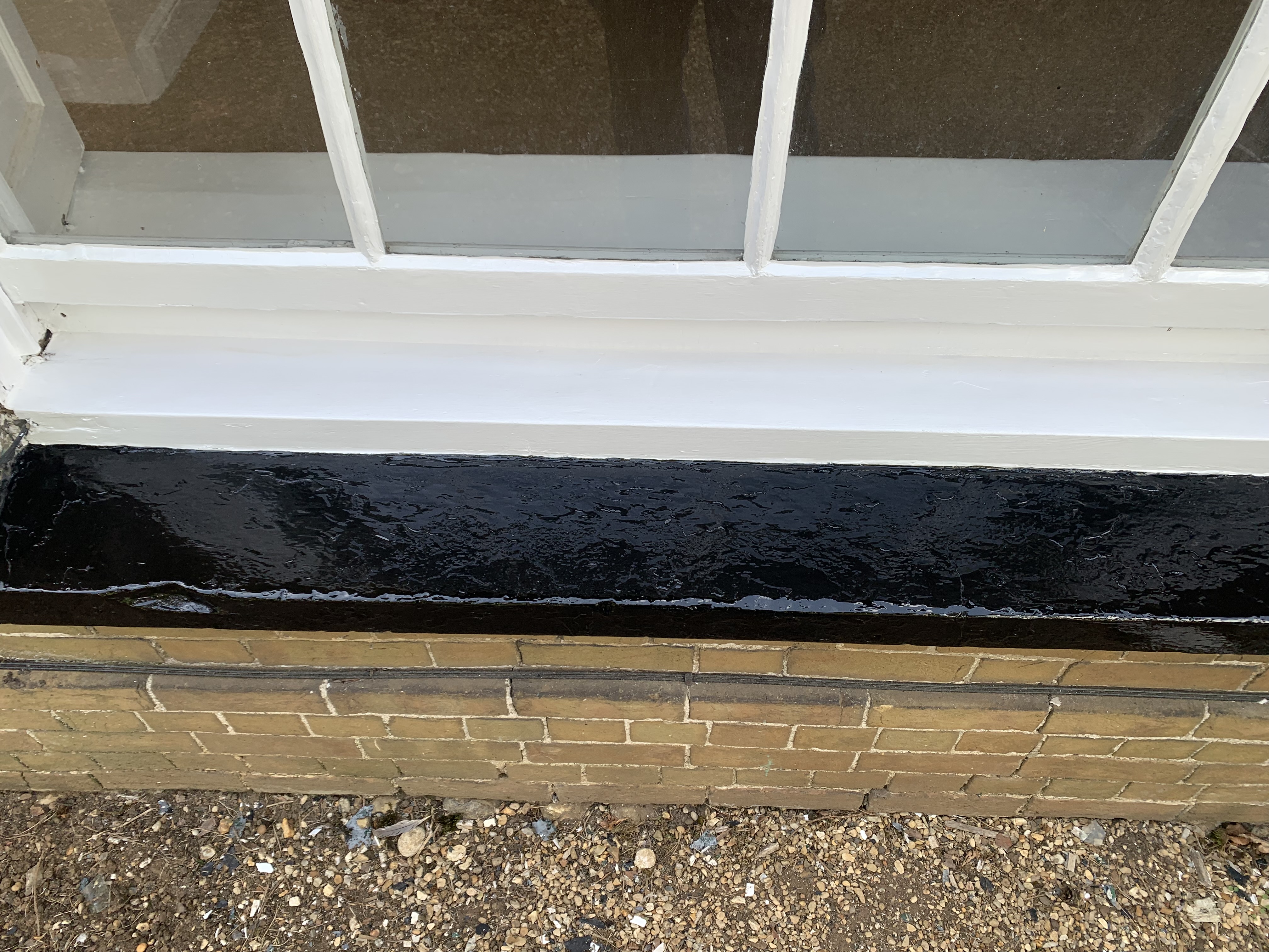 Exterior woodwork and trim prepared for professional painting