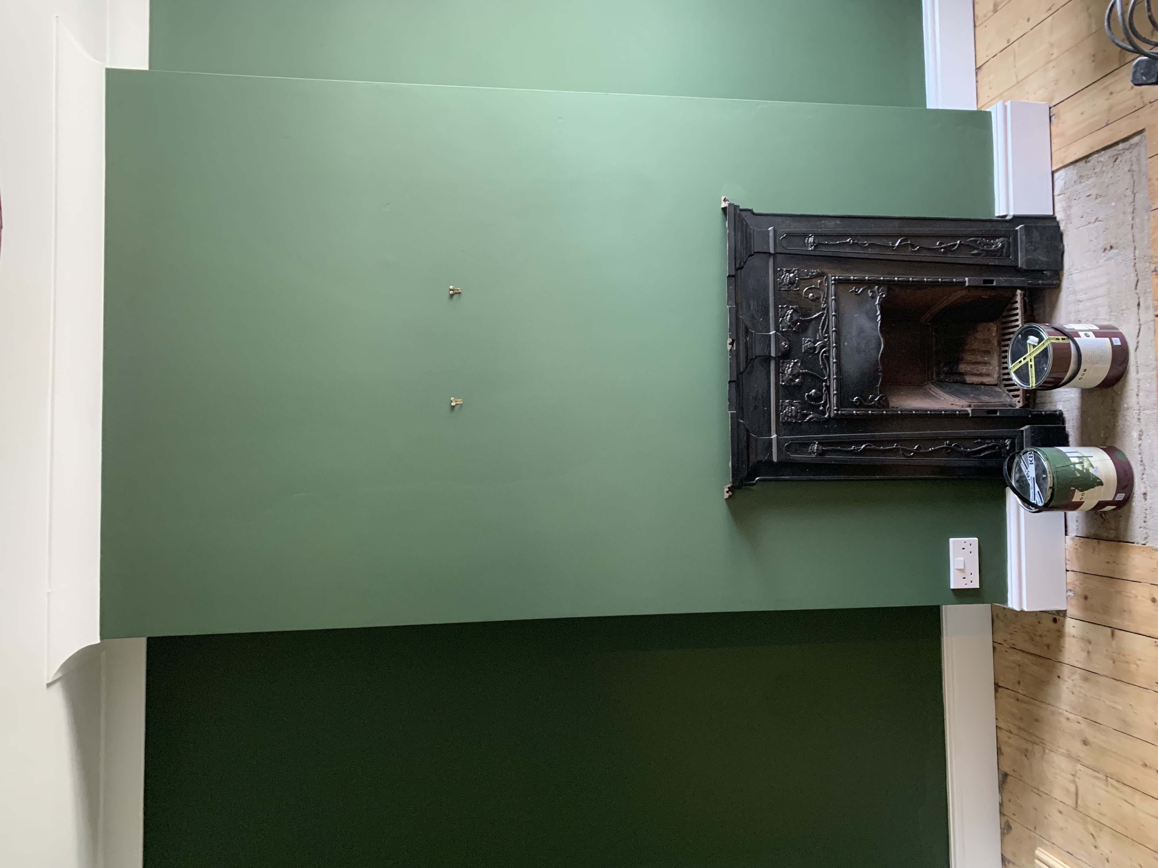 Professional plasterer applying a skim coat to an interior wall