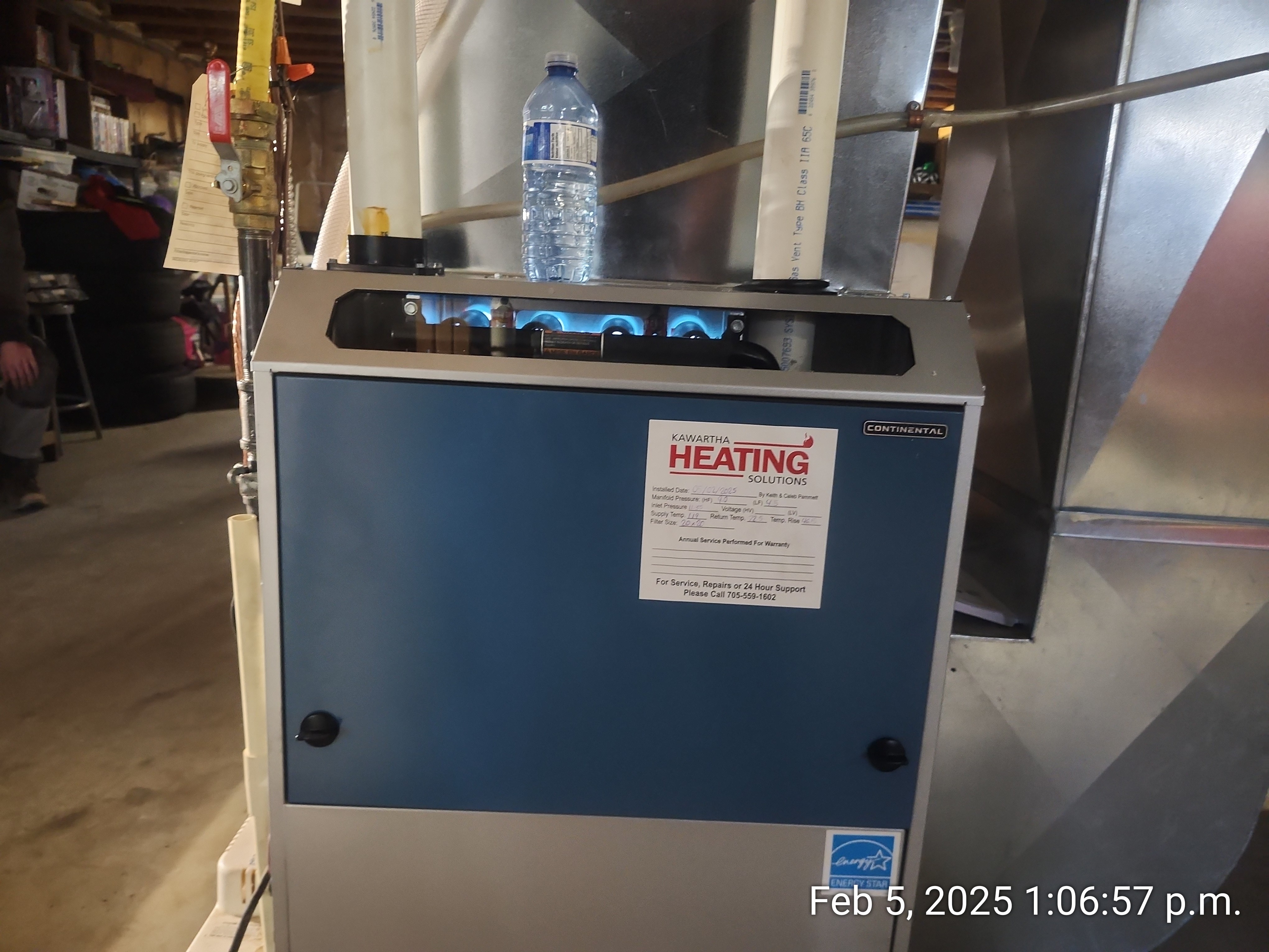 Annual professional service is not just for performance, it is a mandatory requirement for keeping your Napoleon warranty valid. A technician using a digital manometer to adjust gas pressure on a furnace, a key part of annual maintenance required for warranty protection.