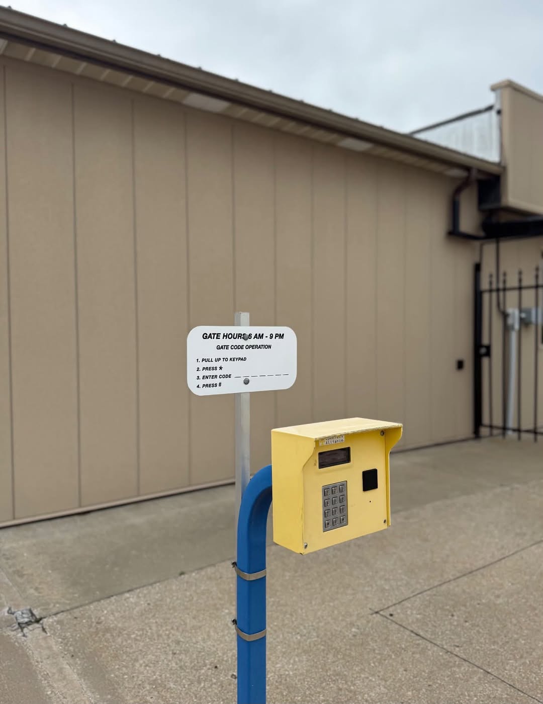 Modern video surveillance is a non negotiable feature for protecting your stored valuables. A high quality security camera mounted on a storage building overlooking rows of units.