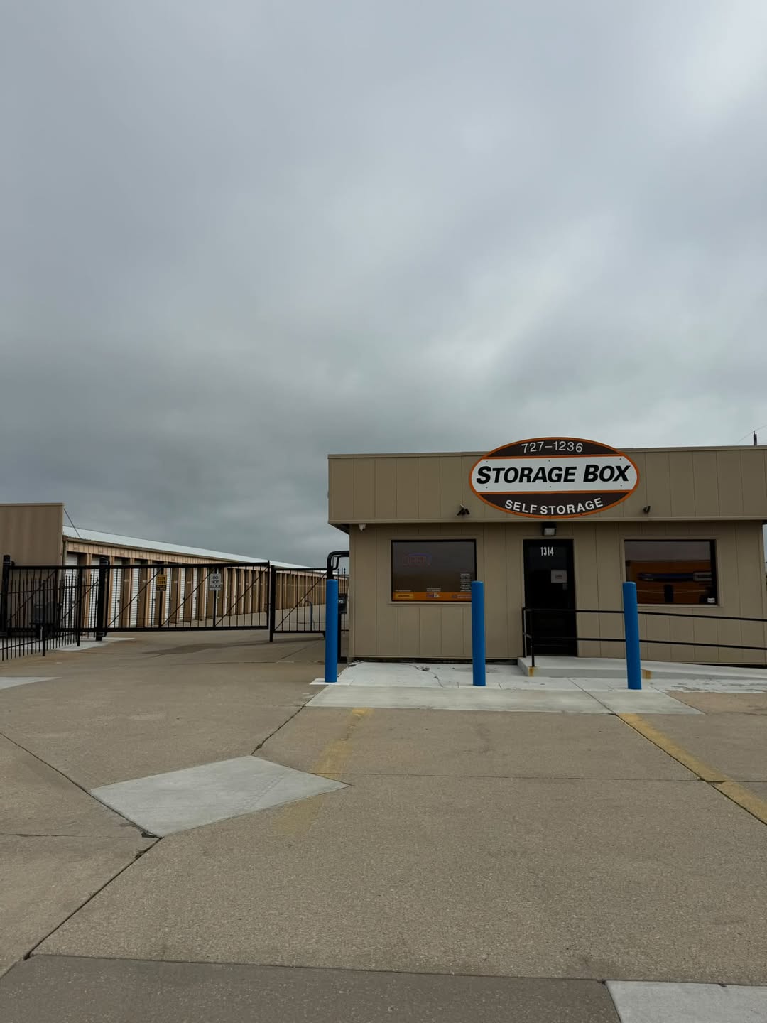 Choosing the right unit size ensures you only pay for the space you actually need. Interior view of a clean, well lit storage unit corridor with various door sizes.