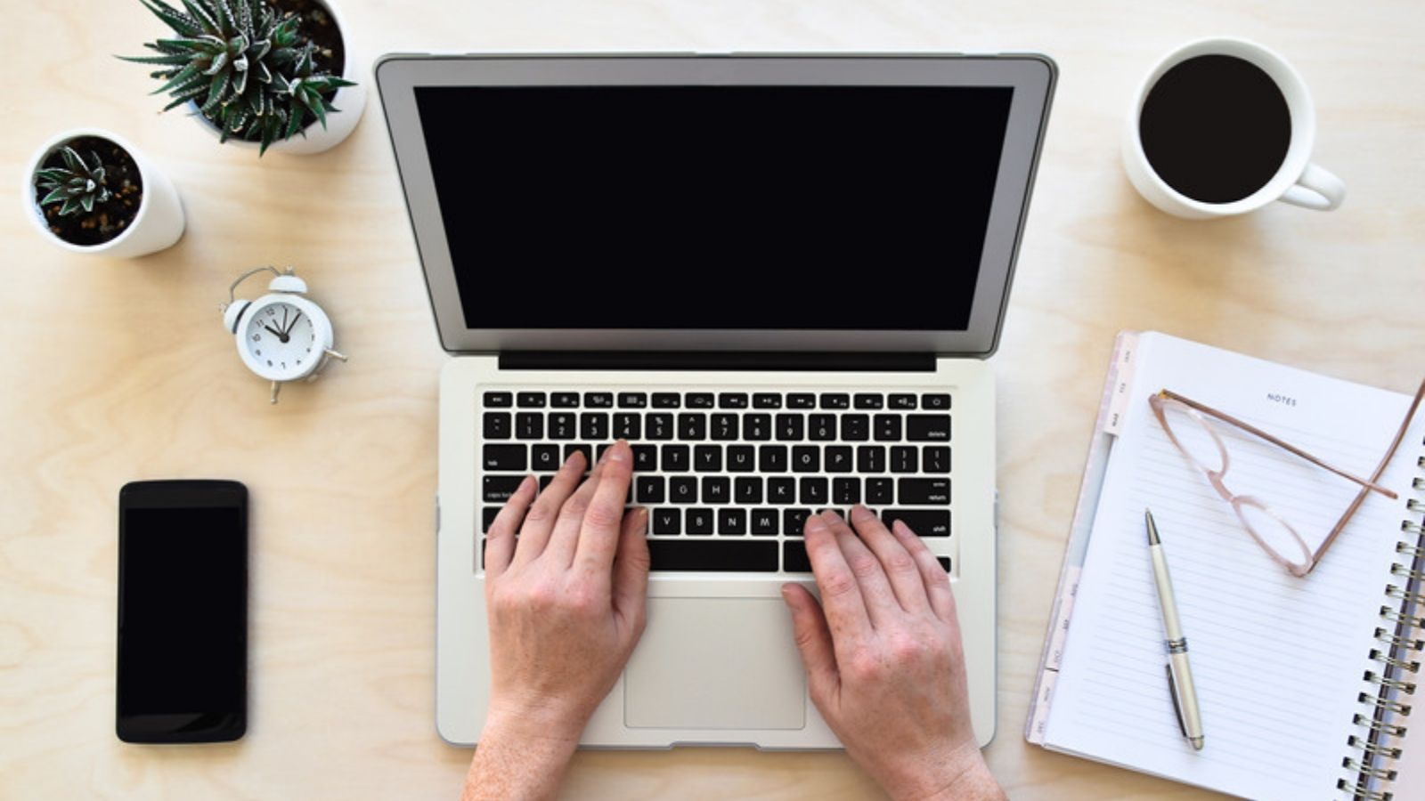 Laptop on a desk being kept up to date, Getting Your Online Presence Under Control