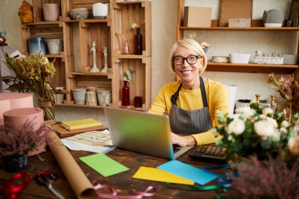 Small business cybersecurity: shop owner working on a laptop