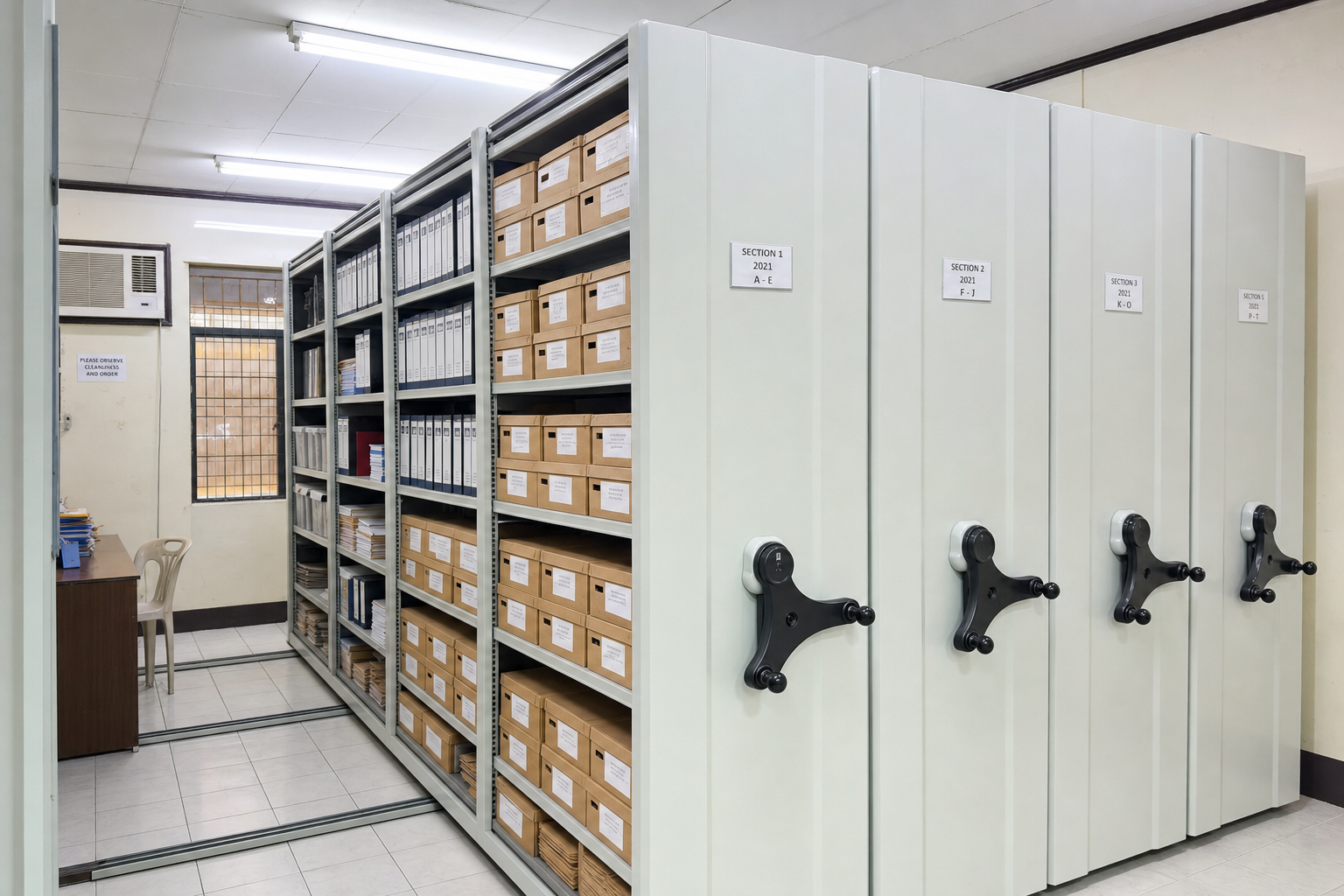 Mobile compactors are the gold standard for high-density library archives and record management. A mobile compactor storage system showing high-density shelving used for archives and libraries.