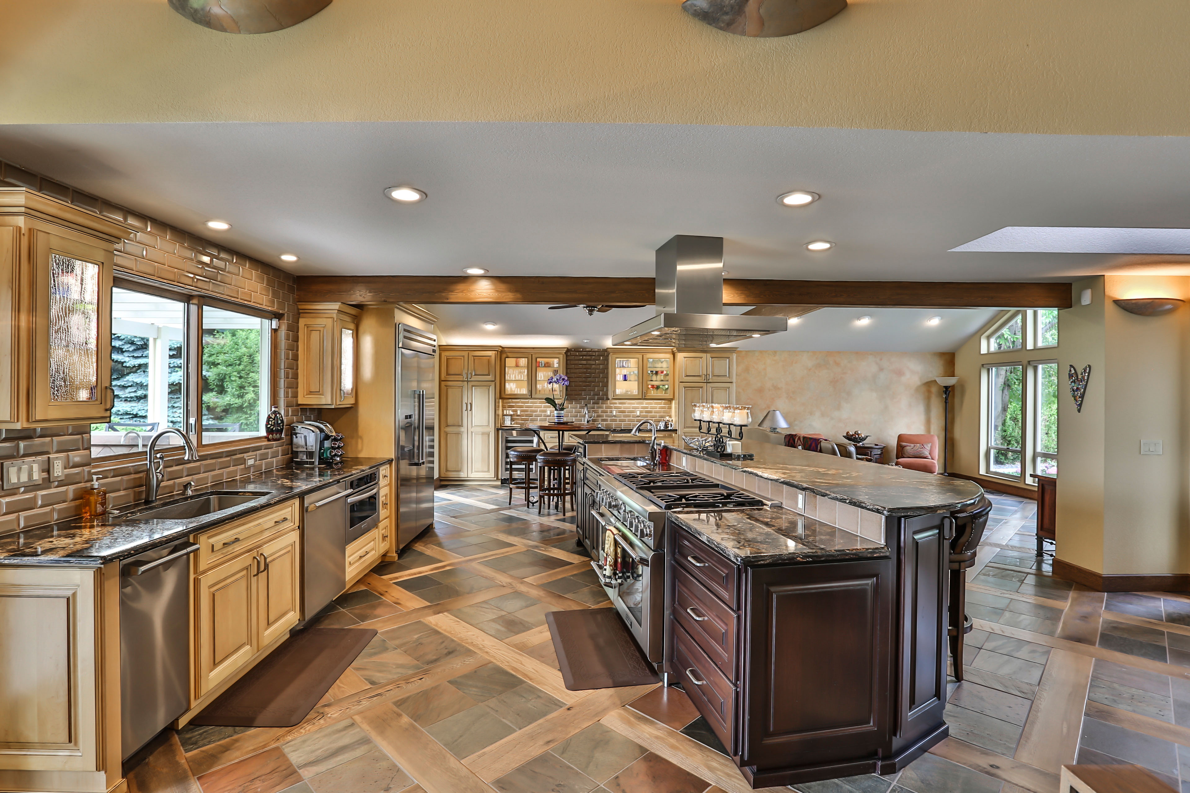 Opening up a kitchen often involves complex structural work to create a seamless flow between rooms. Professional contractor working on a modern kitchen remodel where structural walls were likely modified.