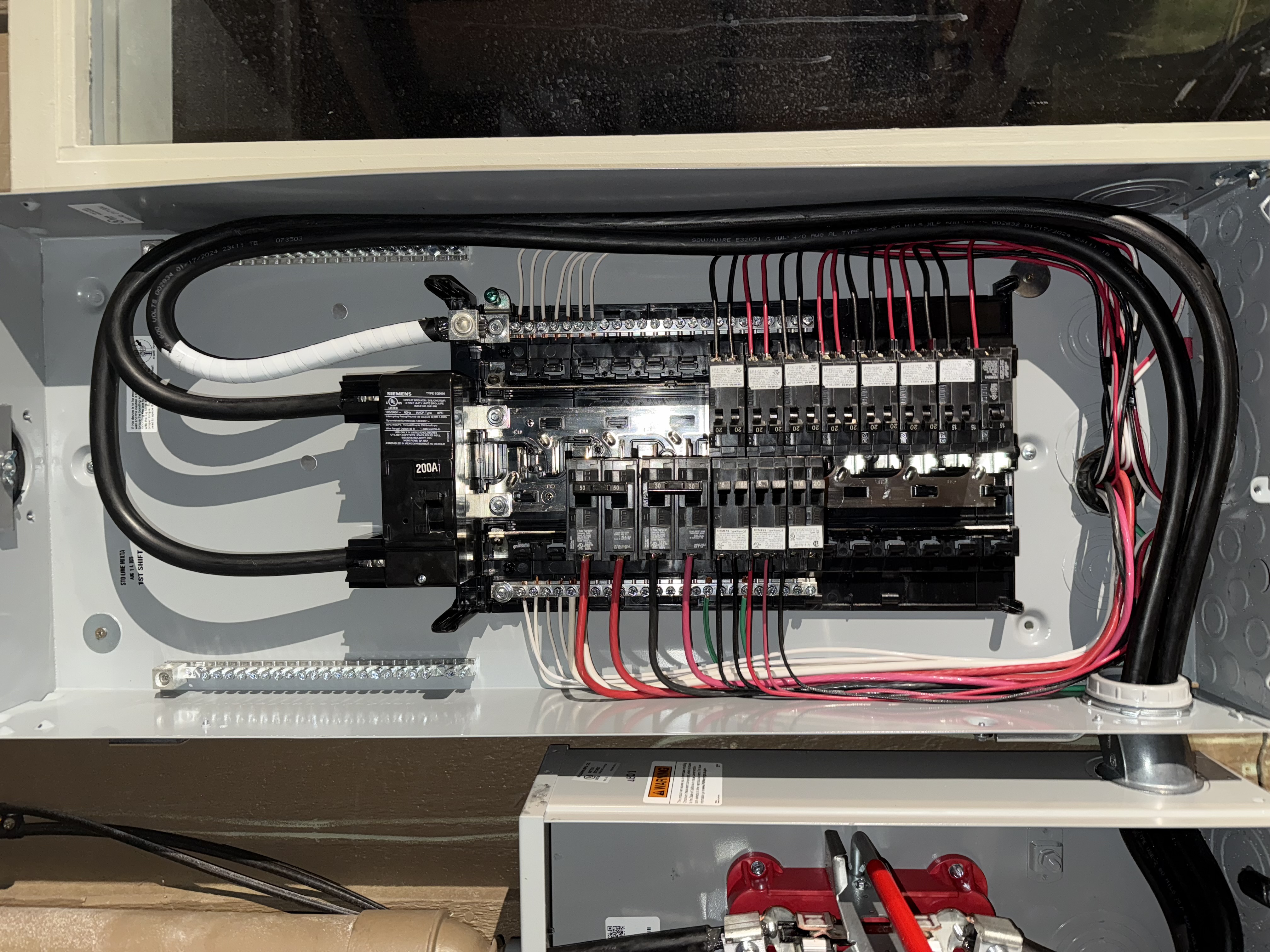Precision labeling and neat wiring are hallmarks of a high end electrical service upgrade. A perfectly organized and meticulously labeled electrical panel showing professional craftsmanship.