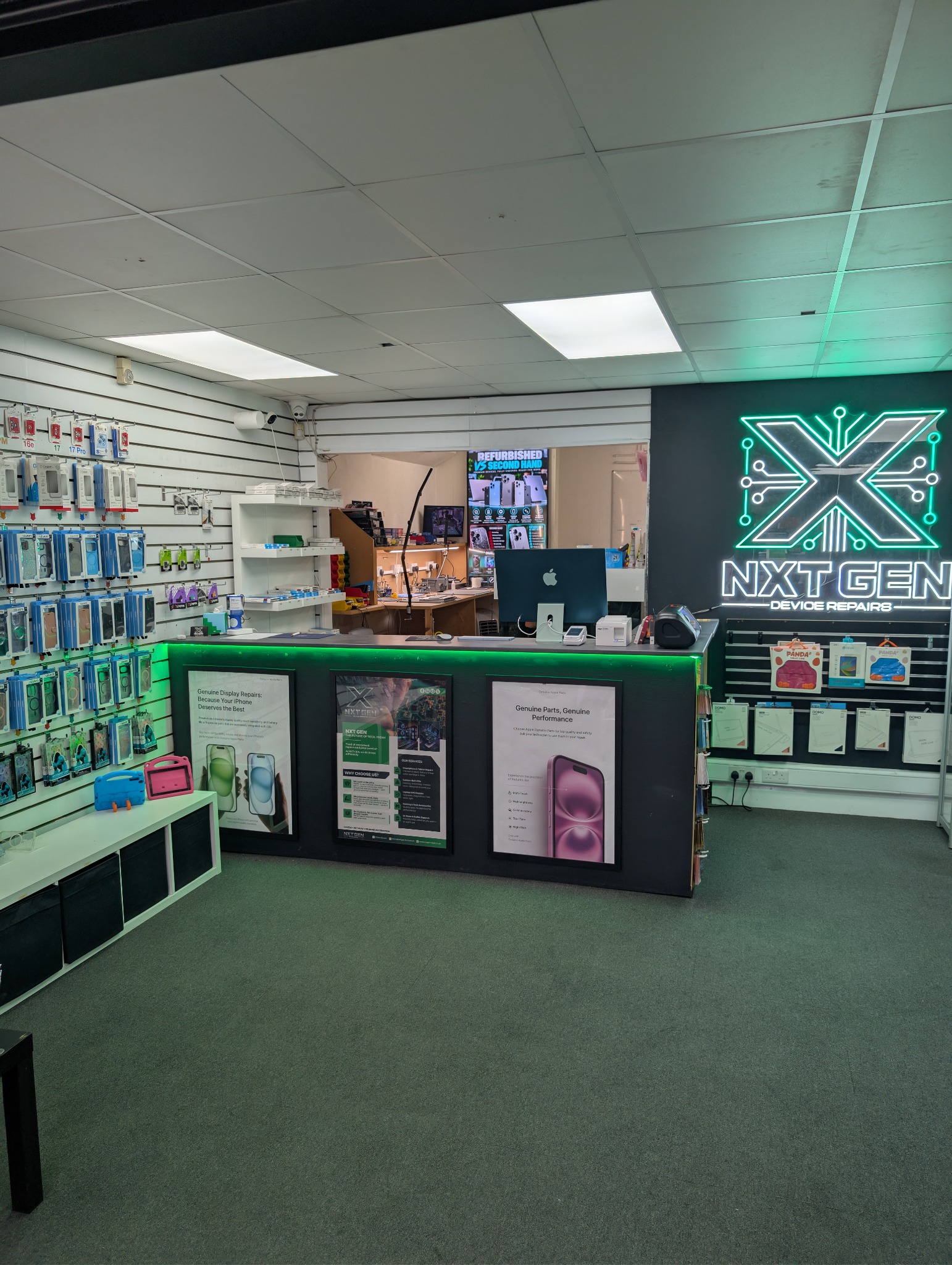 NXT GEN shop counter with illuminated logo and accessories displays